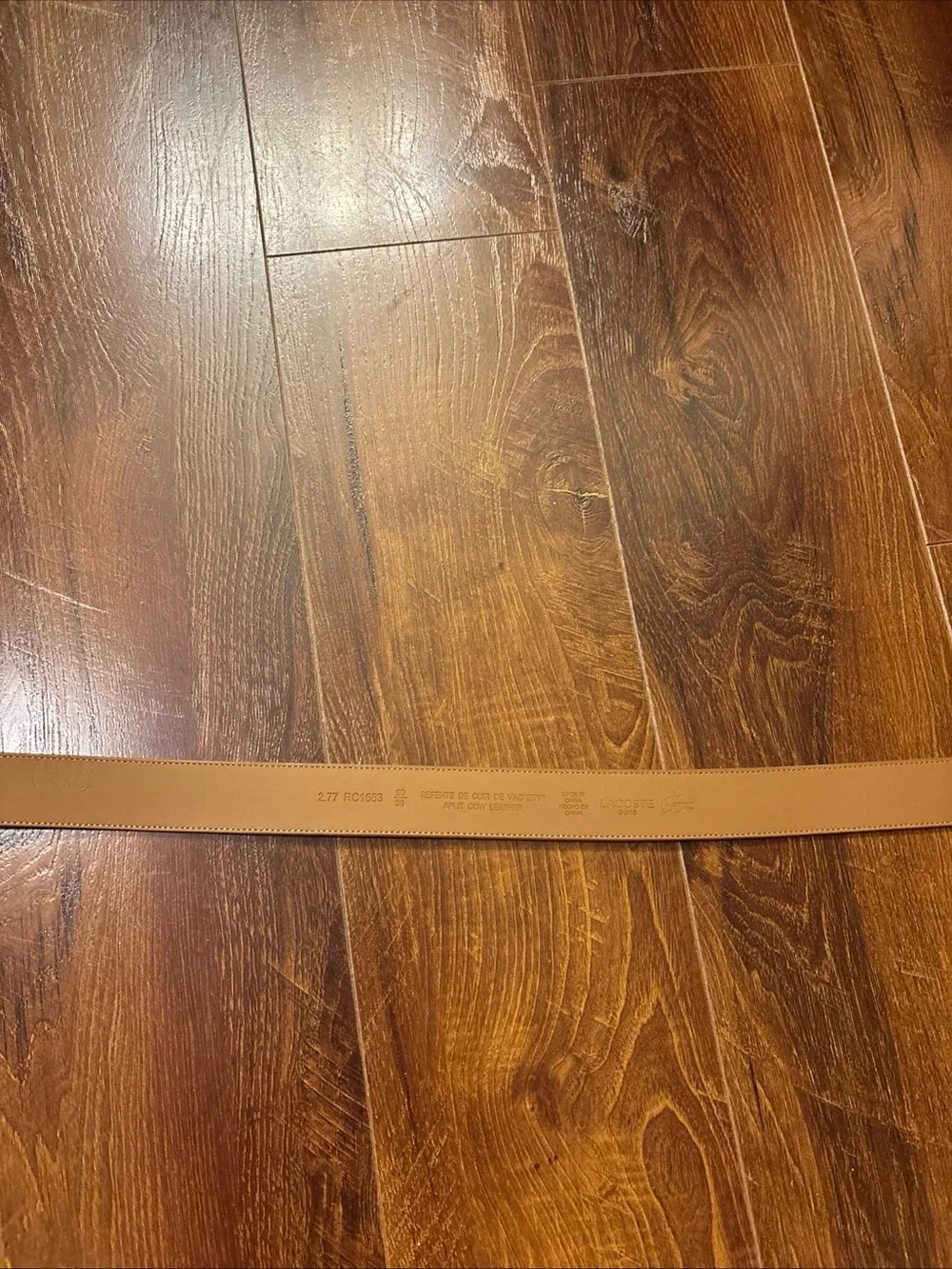 Tan Lacoste belt with textured weave pattern size 36